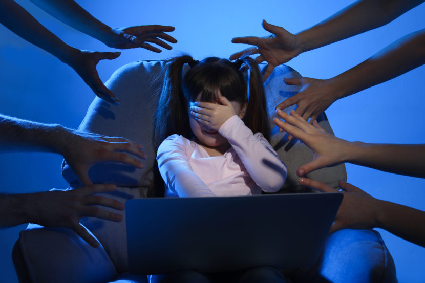 Strangers,Reaching,Frightened,Little,Child,With,Laptop,On,Color,Background.
